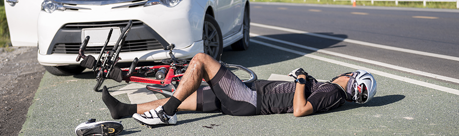 A man lies bleeding in the bike lane after being hit by a car